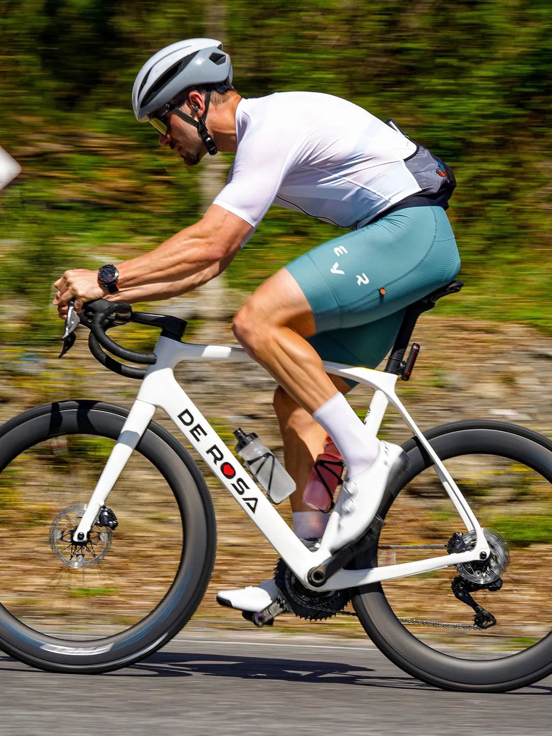 Road cyclist riding through open terrain on a long day