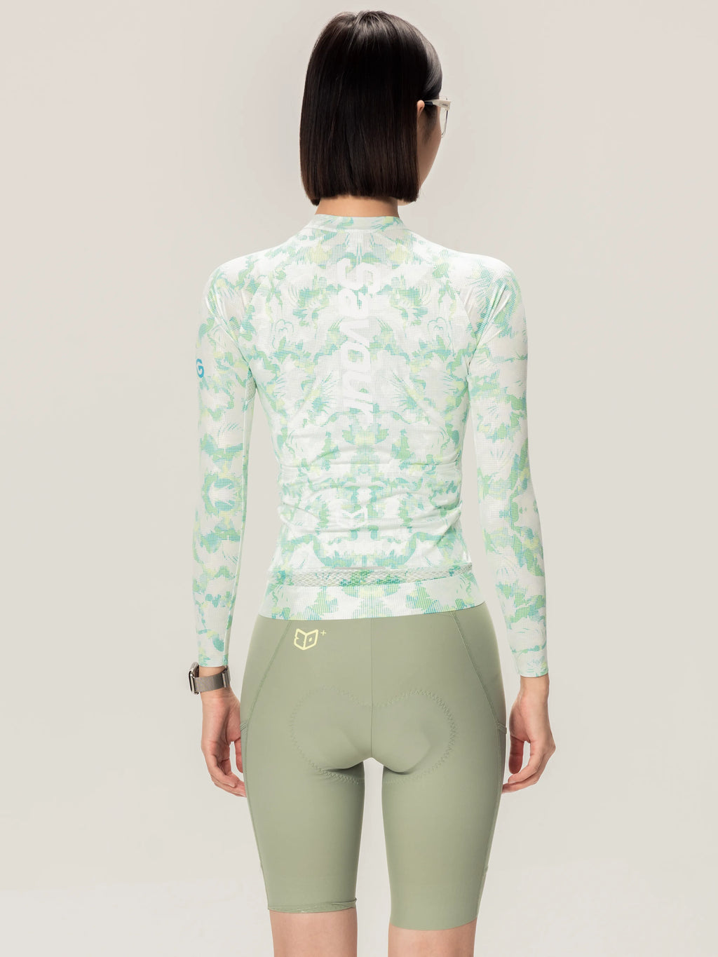 A unisex cycling jersey long-sleeved high neck in light mint green white camouflage by lameda x australian studio