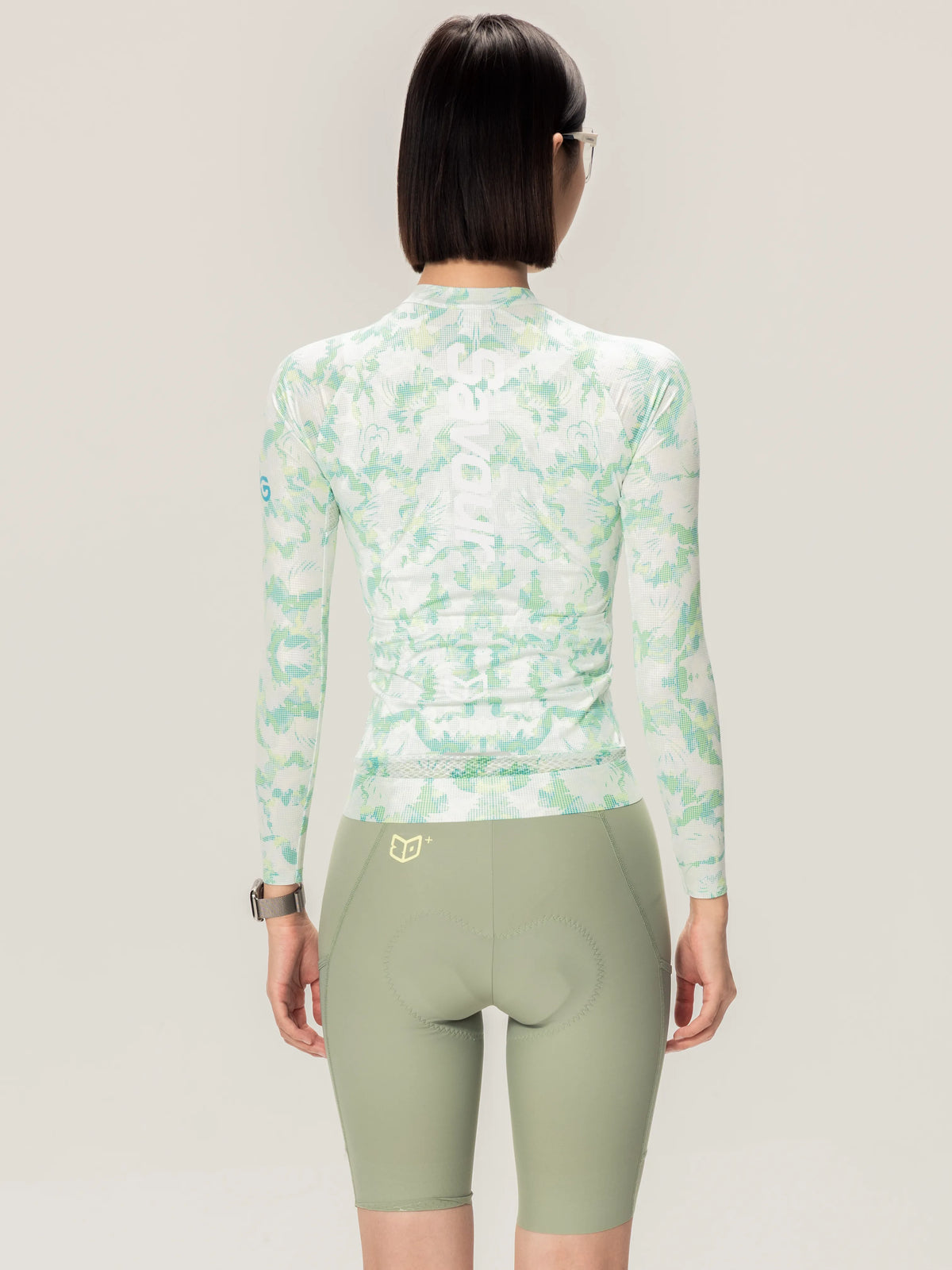 A unisex cycling jersey long-sleeved high neck in light mint green white camouflage by lameda x australian studio
