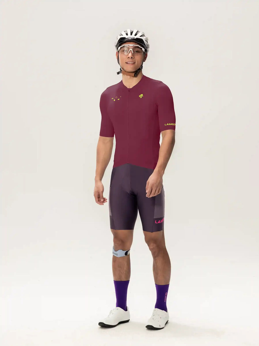 Roam men jersey short sleeves in maroon and gray with subtle yellow logo on chest and sleeve for cycling use