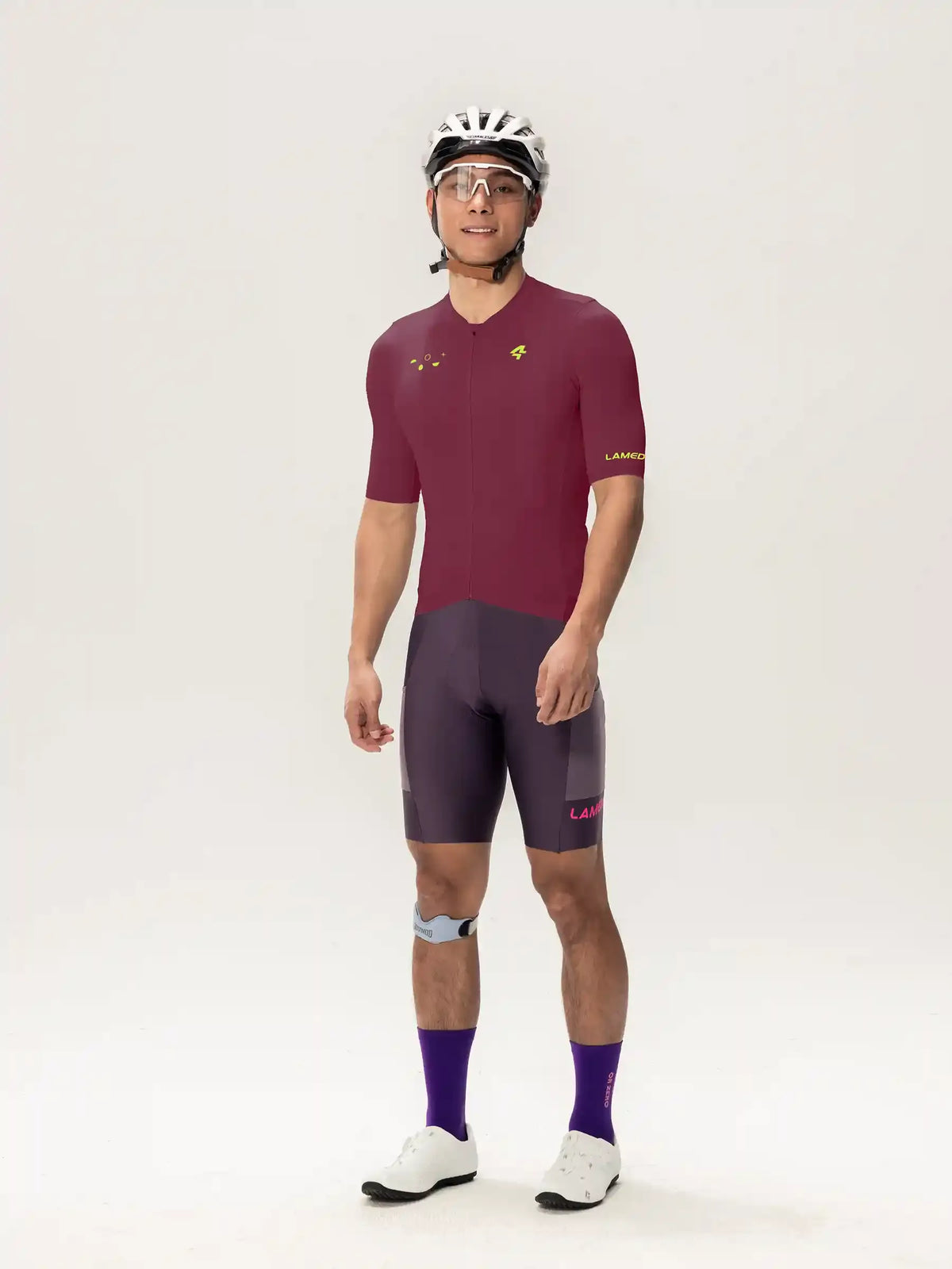 Roam men jersey short sleeves in maroon and gray with subtle yellow logo on chest and sleeve for cycling use