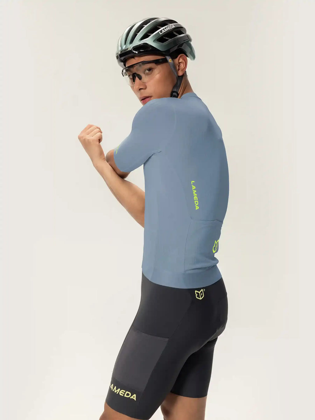 Light blue short-sleeved roam men jersey with neon green laveda branding and matching black cycling shorts set