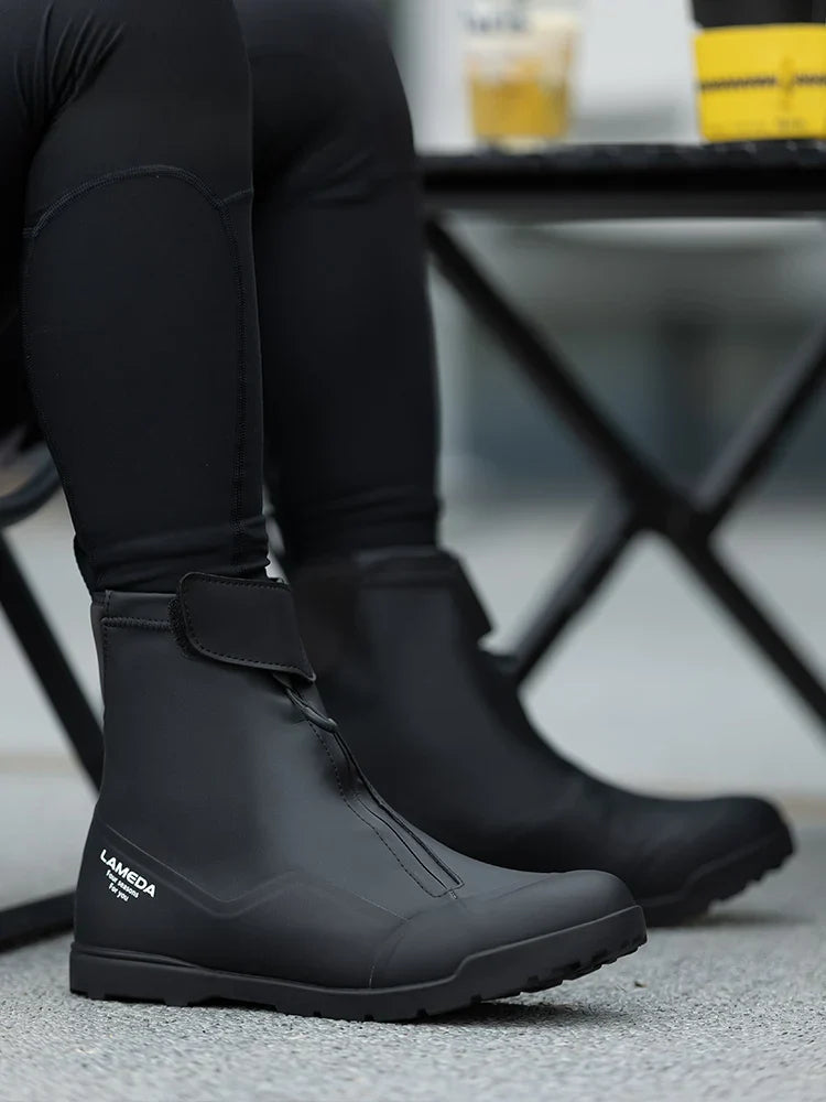 Black lameda winter cycling boots with matte waterproof finish zipper closure and stiffened sole for cold weather use
