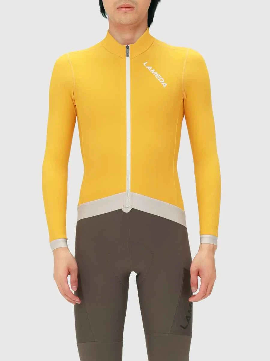 Freeze men’s fleeced thermal cycling jersey in bright yellow with white zipper and gray waist trim for cold weather use
