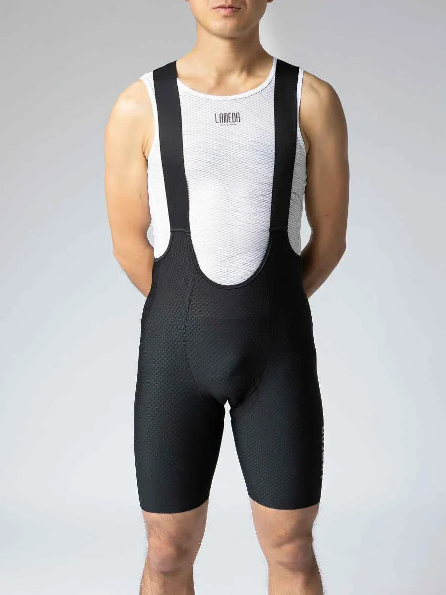 Kylin men’s bib shorts in black with white mesh panel and black straps featuring elastic interface chamois and upf50+ protection