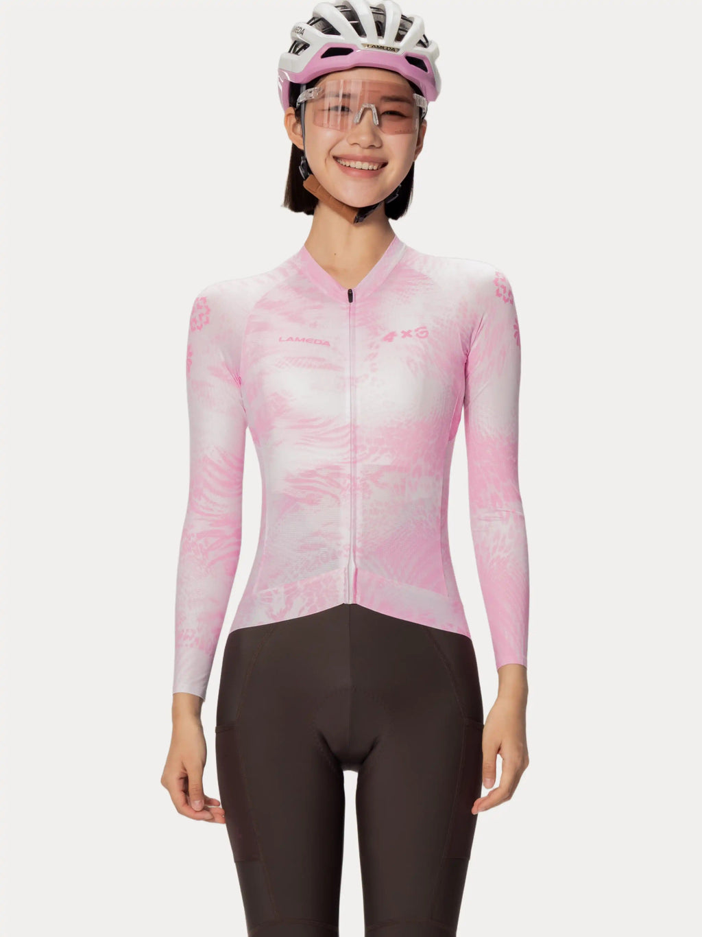Pink and white gradient long-sleeved lameda x australian unisex cycling jersey with subtle pattern for studio cycling