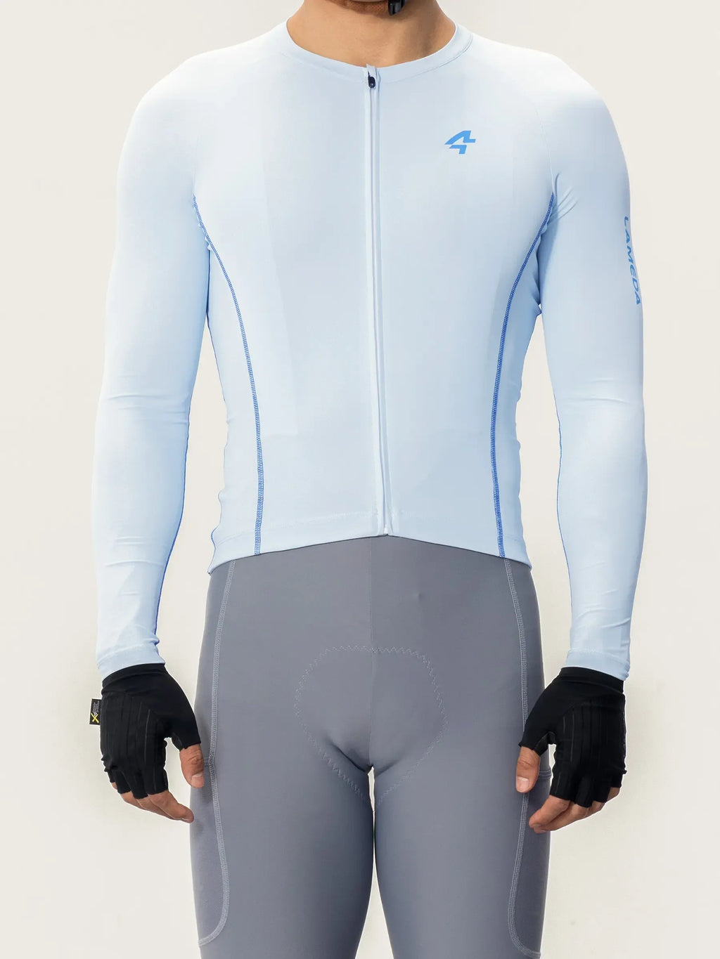 Light blue wind chaser men jersey long sleeves with subtle blue stitching and small chest logo for cycling use