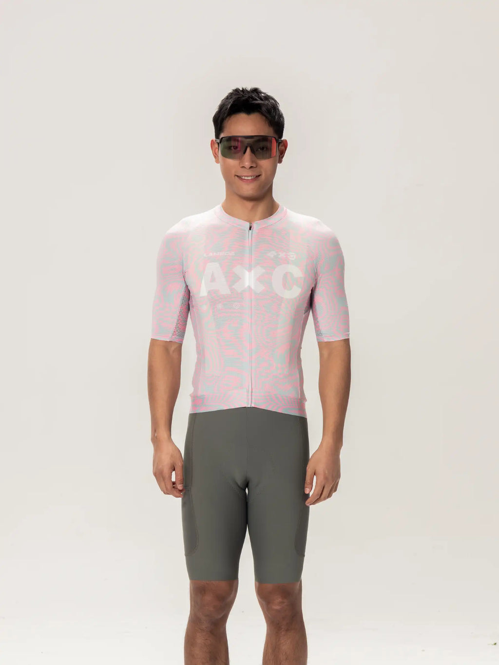 A unisex cycling jersey in pink and light blue pattern with full-length zipper short sleeves by lameda x australian