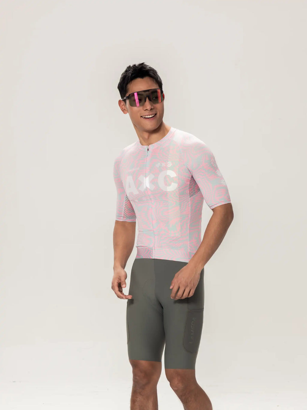 Peach pink and light blue patterned unisex cycling jersey with mesh panels from lameda x australian studio unisex cycling