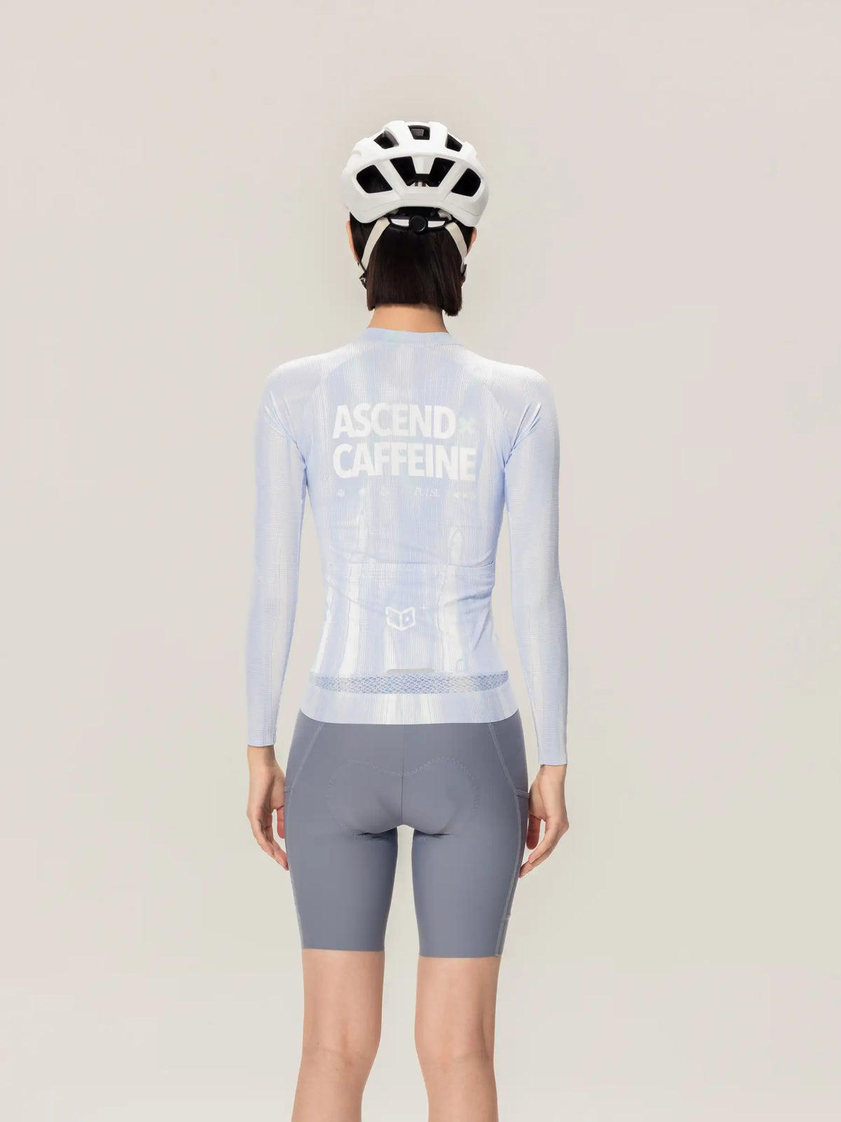 Back view of light blue unisex cycling jersey with long sleeves and ascend caffeine print from lameda x australian studio unisex cycling collection