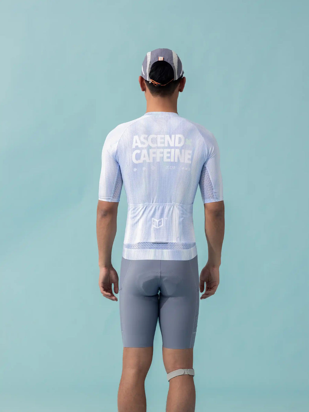 Back of a white unisex cycling jersey lameda x australian with ascend caffeine print breathable mesh and gray accents