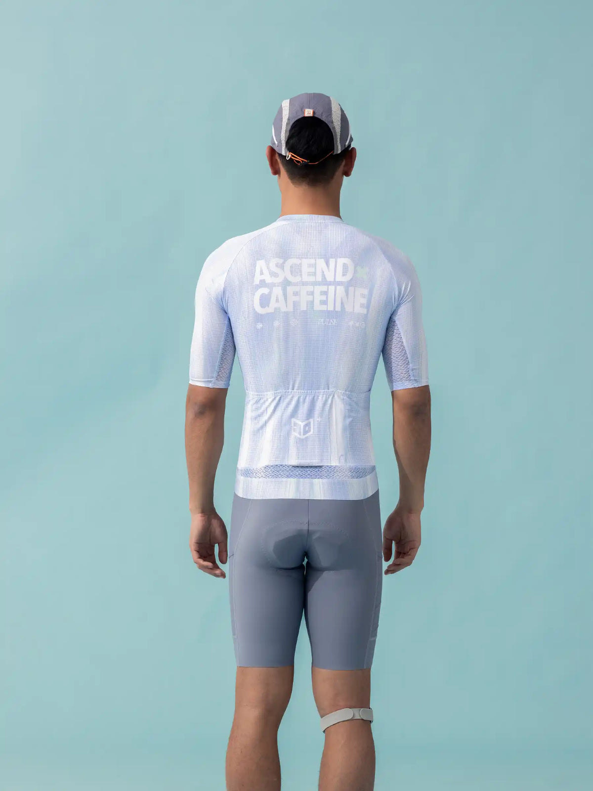 Back of a white unisex cycling jersey lameda x australian with ascend caffeine print breathable mesh and gray accents