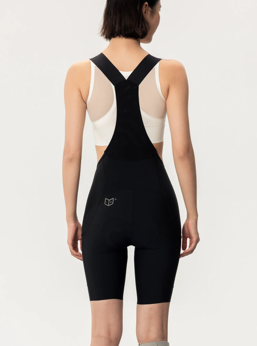 Black lameda women’s cycling bib shorts with breathable mesh panels on the back and elastic interface seat pad