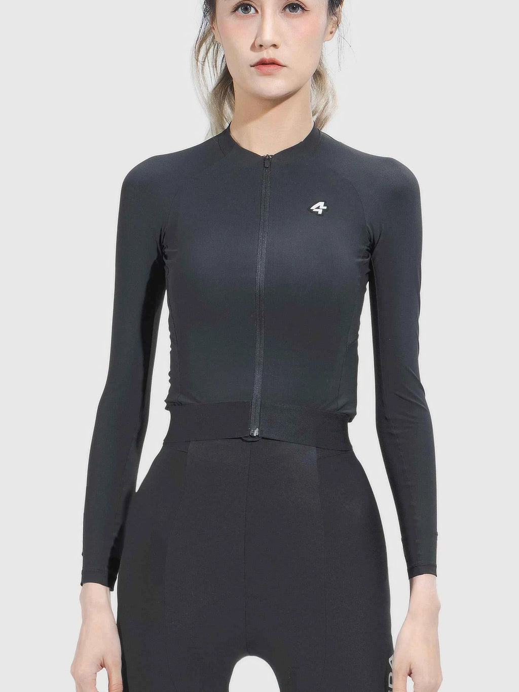 Black ripple grace women’s cycling jersey with full-length zipper subtle white logo and anti-slip hem for comfort