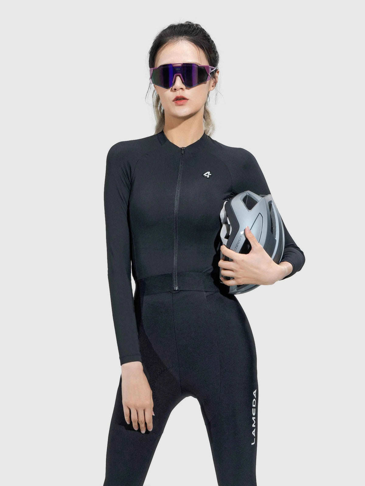 Black ripple grace women’s cycling jersey with zipper front, anti-slip hem, and lameda branding on the leg