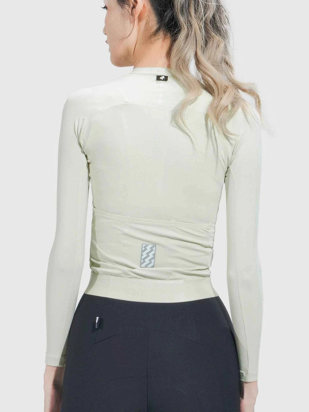 Ripple Grace women’s cycling jersey in cream with a sleek light green long-sleeve design and anti-slip hem
