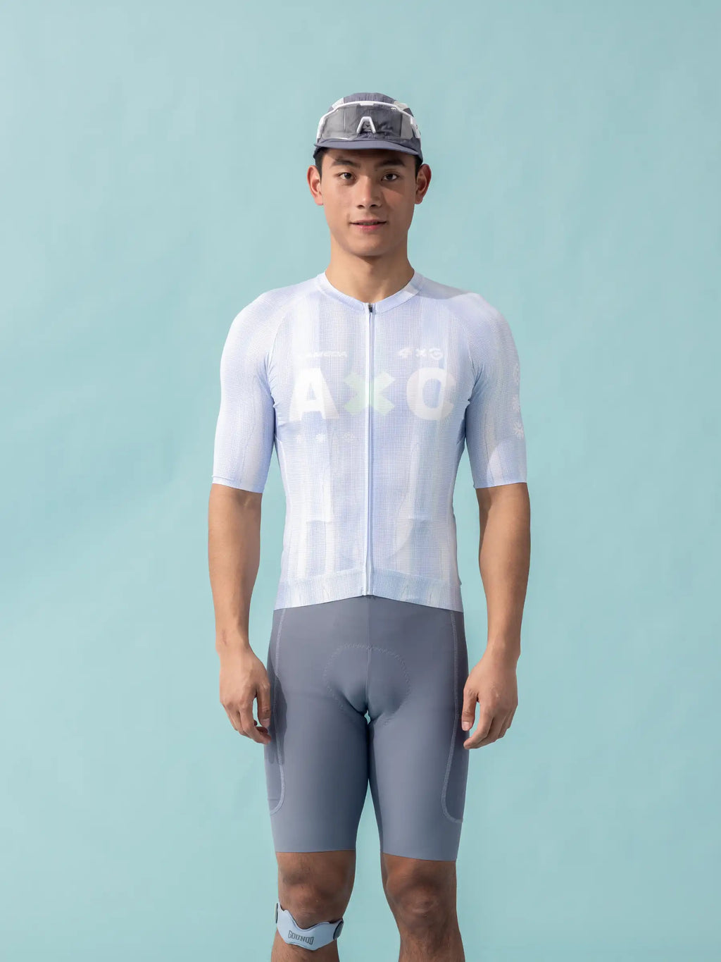 A&o light blue and gray unisex cycling jersey with short sleeves and full-length zipper paired with matching shorts