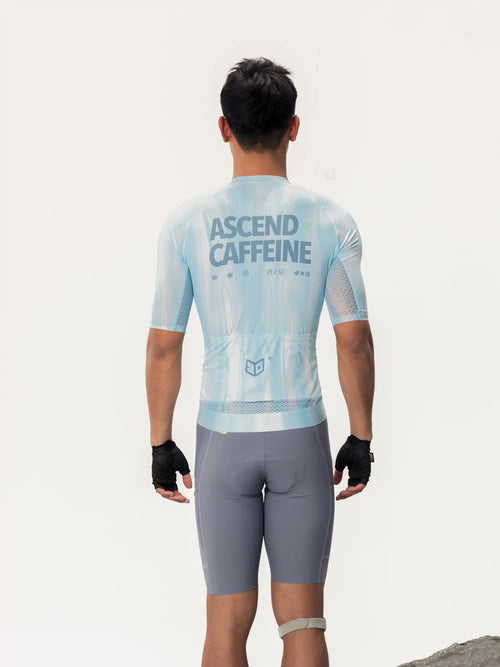Light blue short-sleeved lameda x australian studio unisex cycling jersey showing back with ascend caffeine print