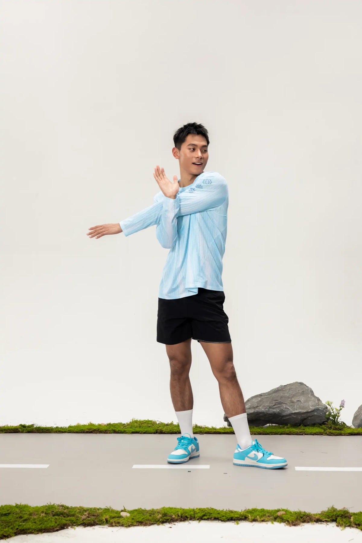 Light blue A x C unisex lightweight cycling long-sleeve t-shirt with subtle branding for outdoor adventures