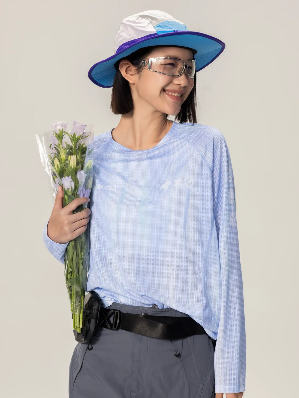 Light blue A x C unisex lightweight cycling long-sleeve t-shirt with subtle white grid pattern and highly breathable fabric