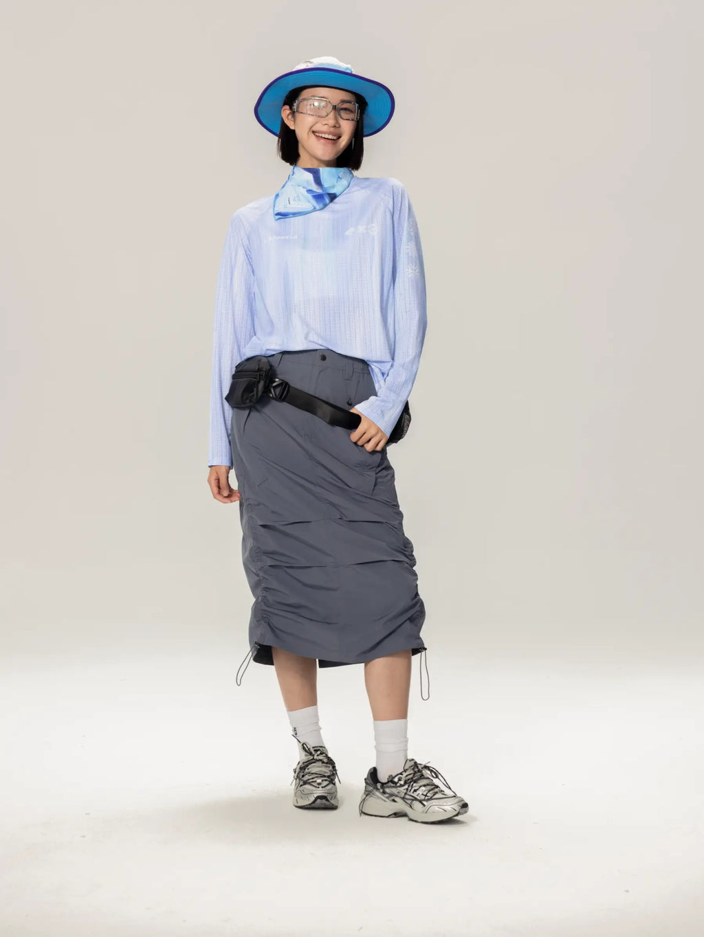 Blue lightweight cycling long-sleeve t-shirt with highly breathable fabric shown with a blue wide-brimmed hat