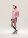 A x C unisex lightweight cycling long-sleeve t-shirt in pink with geometric pattern paired with lavender lameda shorts for outdoor adventures