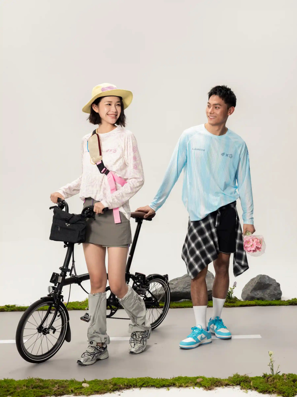 Black foldable bicycle with sleek frame paired with a lightweight cycling long-sleeve t-shirt for outdoor adventures