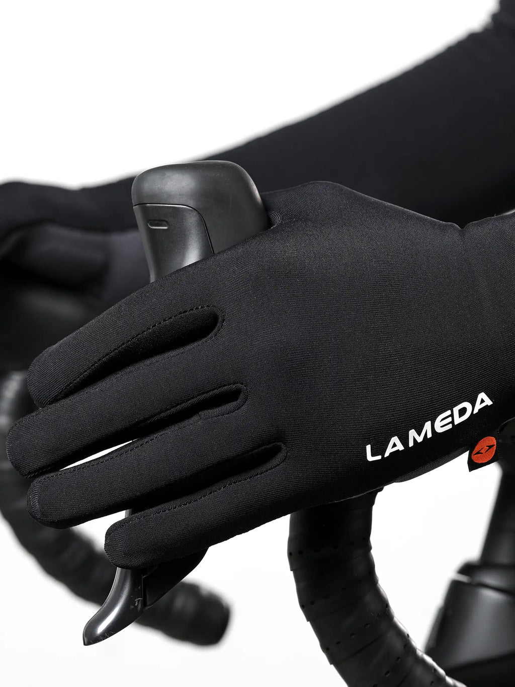 Back side of black 2064 thermal bike gloves with elastic interface, fleece lining, white branding, and orange wrist logo