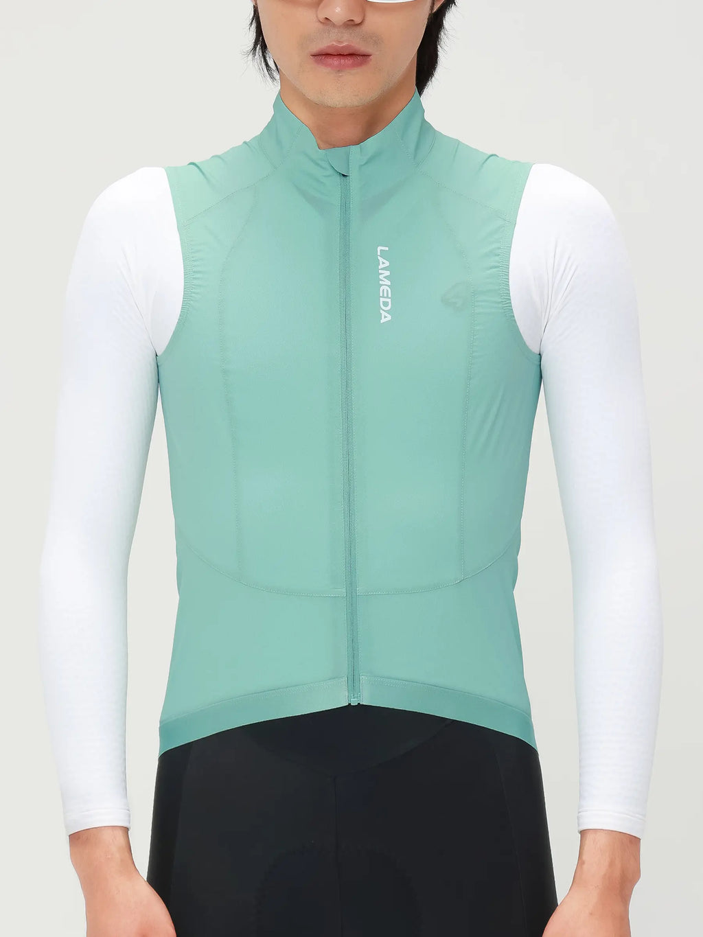 Nova men’s cycling windproof vest in light teal made with recycled polyester and sorona t800 yarn paneling