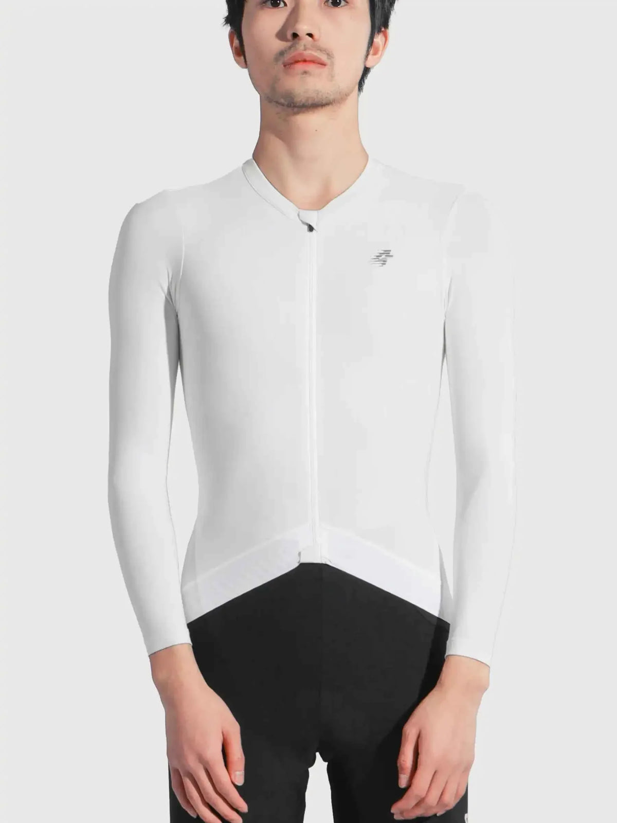 White long-sleeved lameda freedom cycling jersey with black lower panel and subtle new balance logo on chest