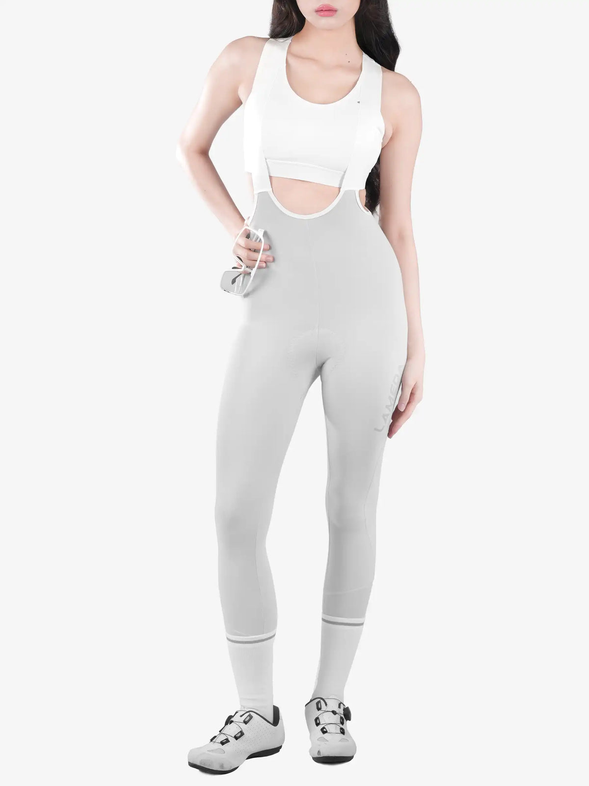A sleek light gray women’s bib tights t462 with brushed fleece lining and cutout details featuring a white sports bra top