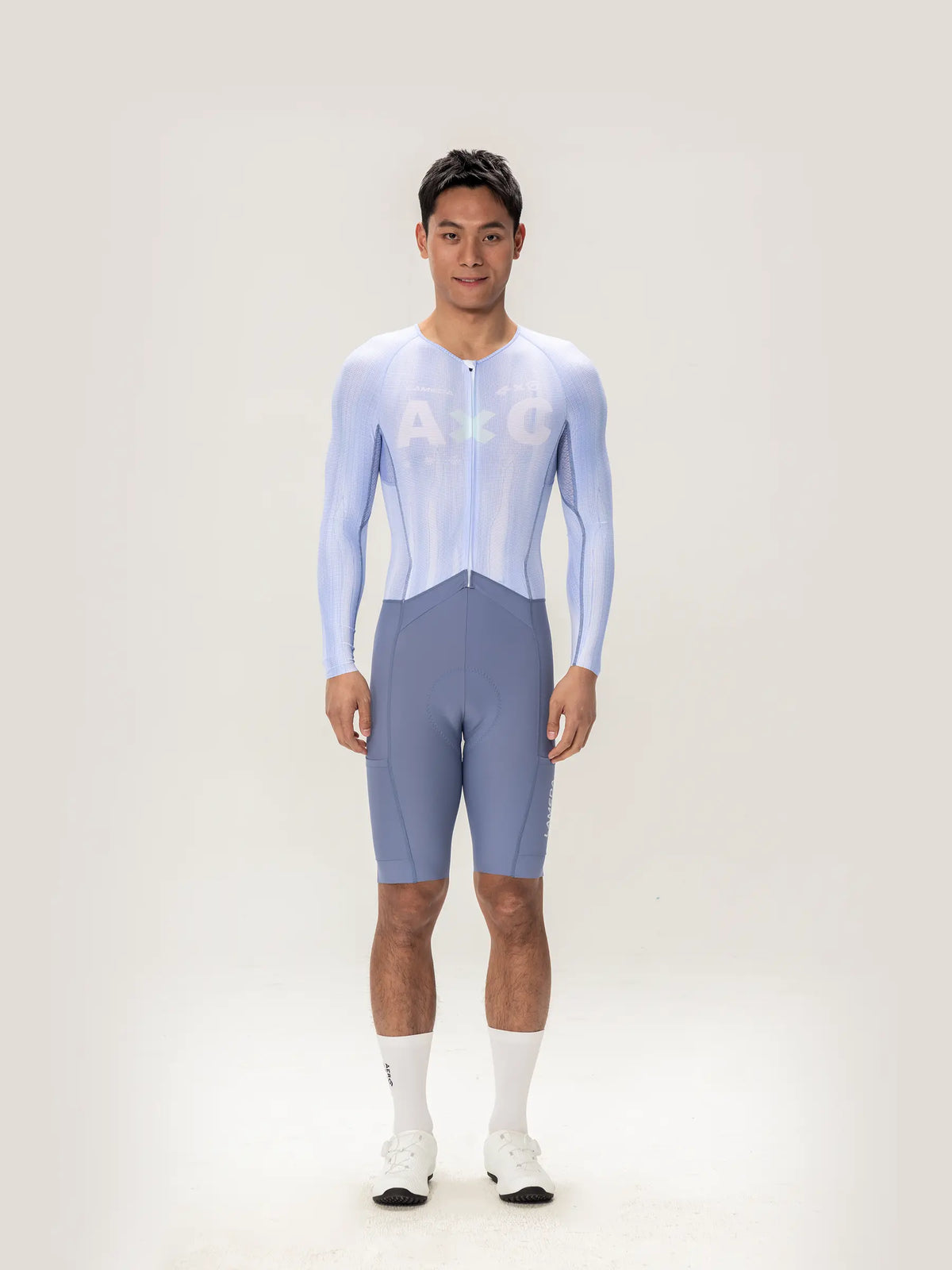 Lameda A*C men skinsuit long sleeves in ice purple with light blue and gray form-fitting cycling design and full-length zipper