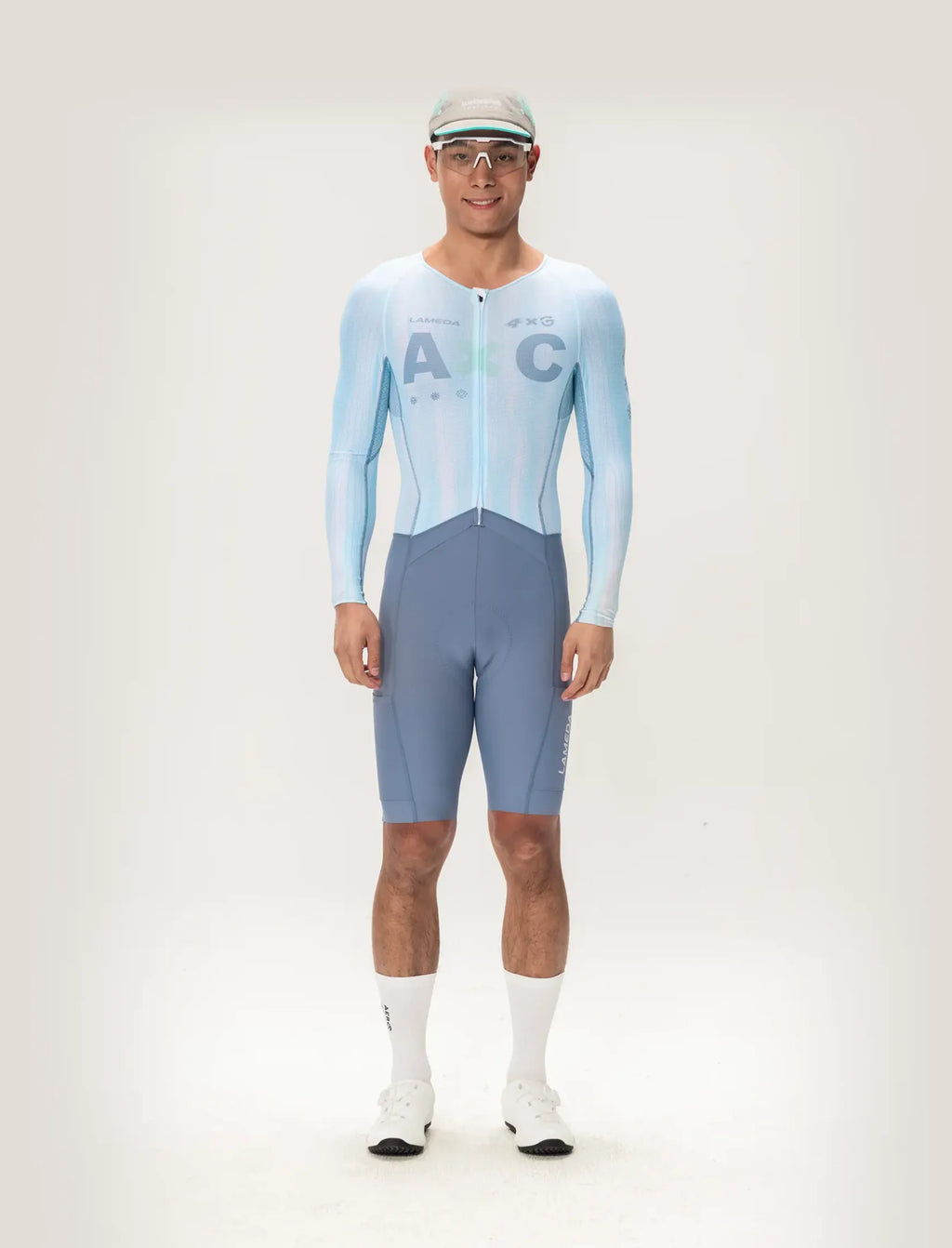 Light blue and gray long sleeve lameda ac men skinsuit featuring ac logo designed for cycling performance