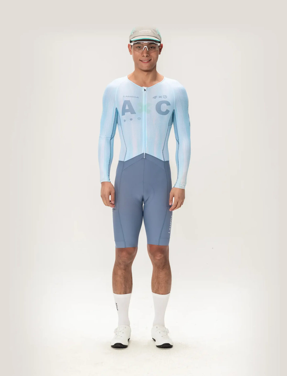 Light blue and gray long sleeve lameda ac men skinsuit featuring ac logo designed for cycling performance