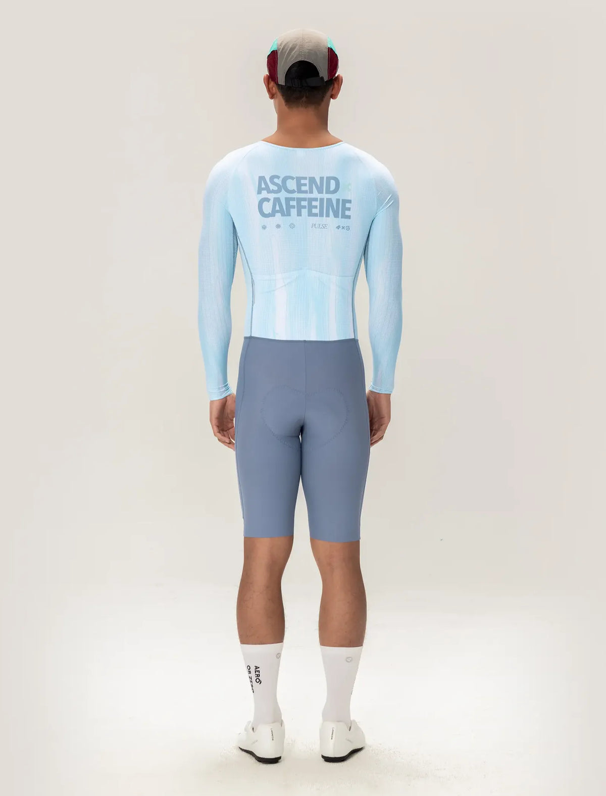 Light blue long-sleeved cycling skinsuit back with ascend caffeine printed in dark gray for men