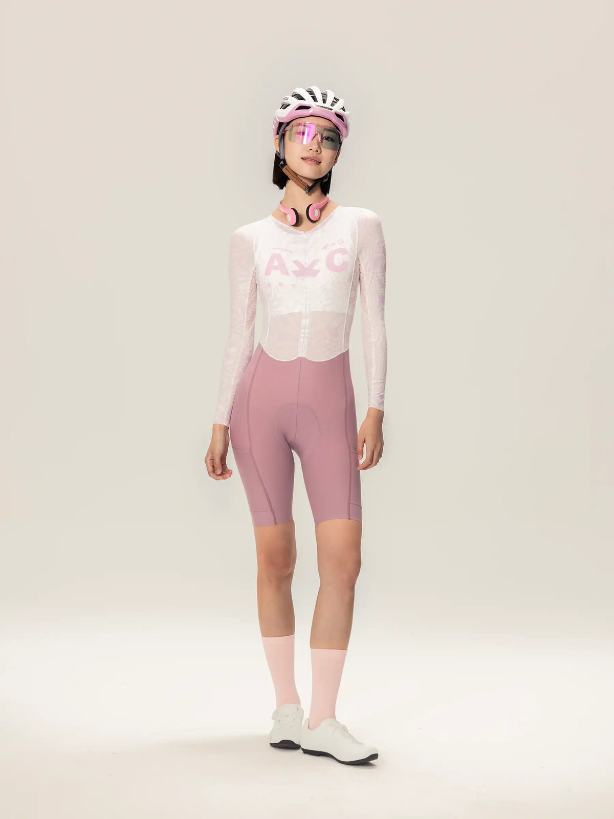 Lameda A*C women cycling skinsuit long sleeves in pink and white with mesh panels and fitted design