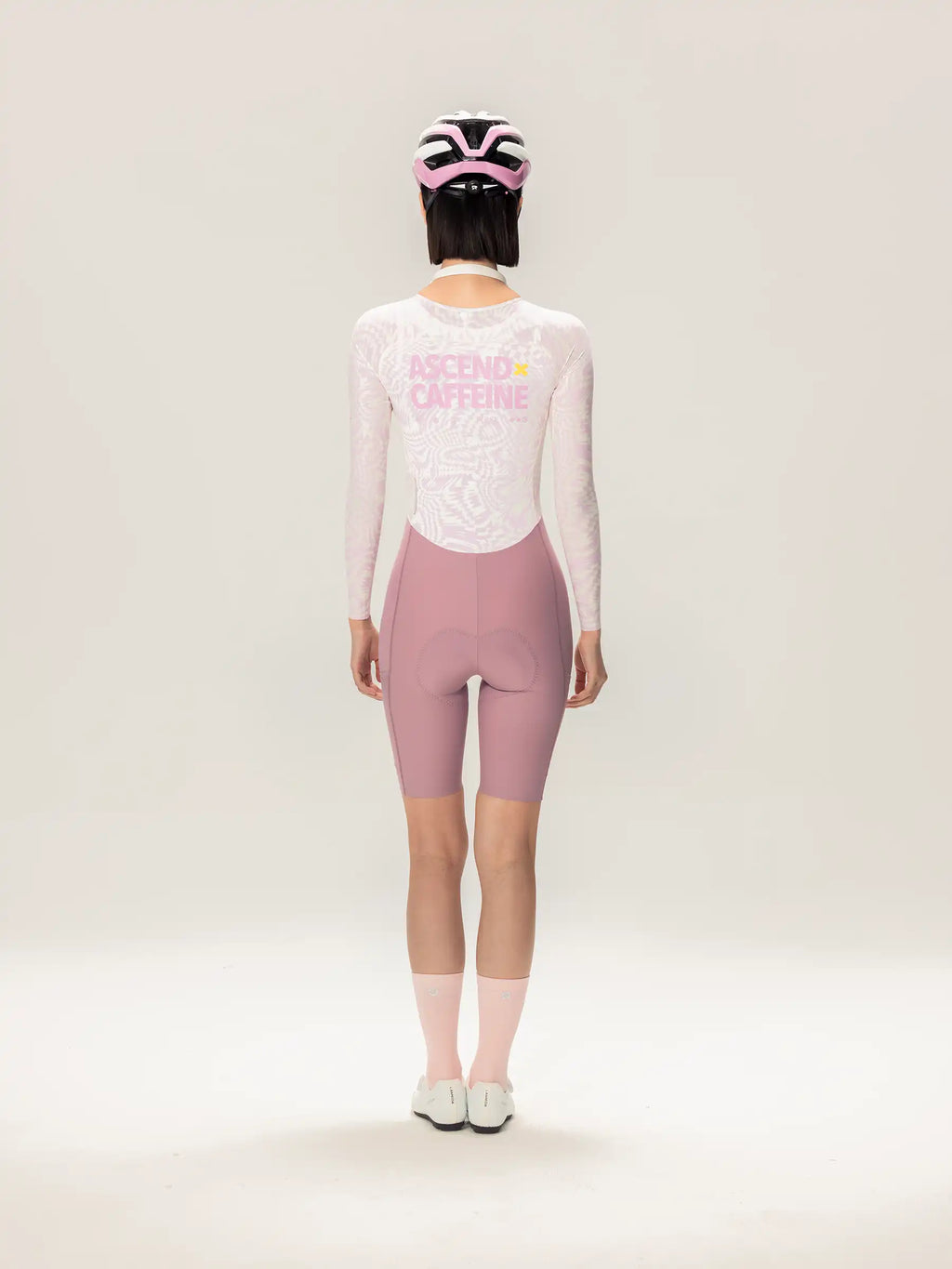 Lameda A*C women skinsuit long sleeves cycling jersey in pink and white with a mesh back panel for breathability