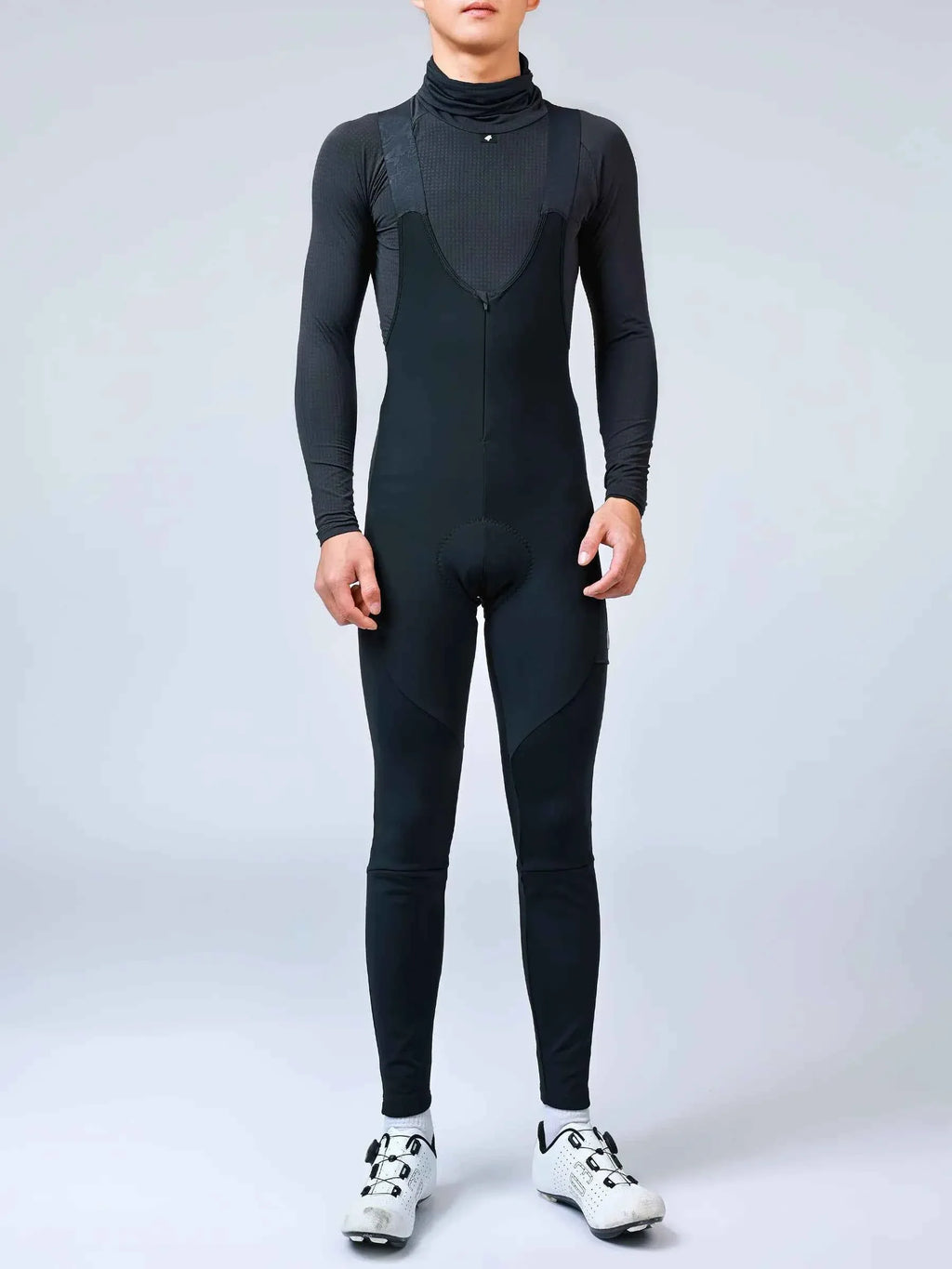 Black form-fitting thermal bib tights with subtle textured panels and high collar spear men’s thermal fleeced bib tights
