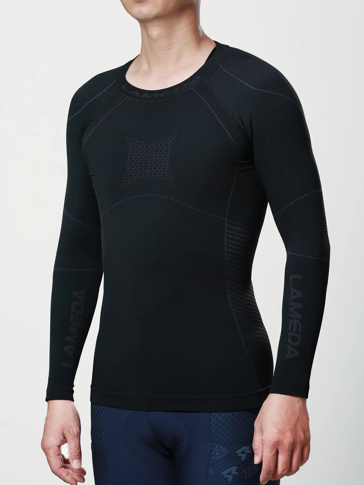Men’s black long-sleeved compression top with gray paneling and lameda branding for cycling compression and muscle support