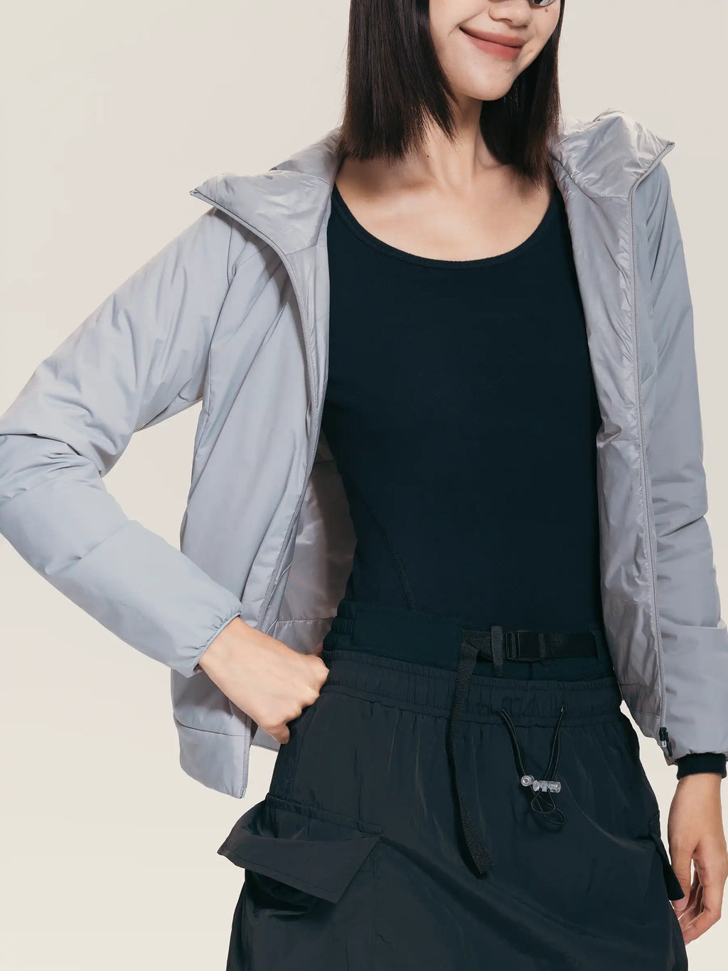 Light gray lameda women’s insulated jacket with shiny quilted exterior hood and 3m™ thinsulate™ insulation