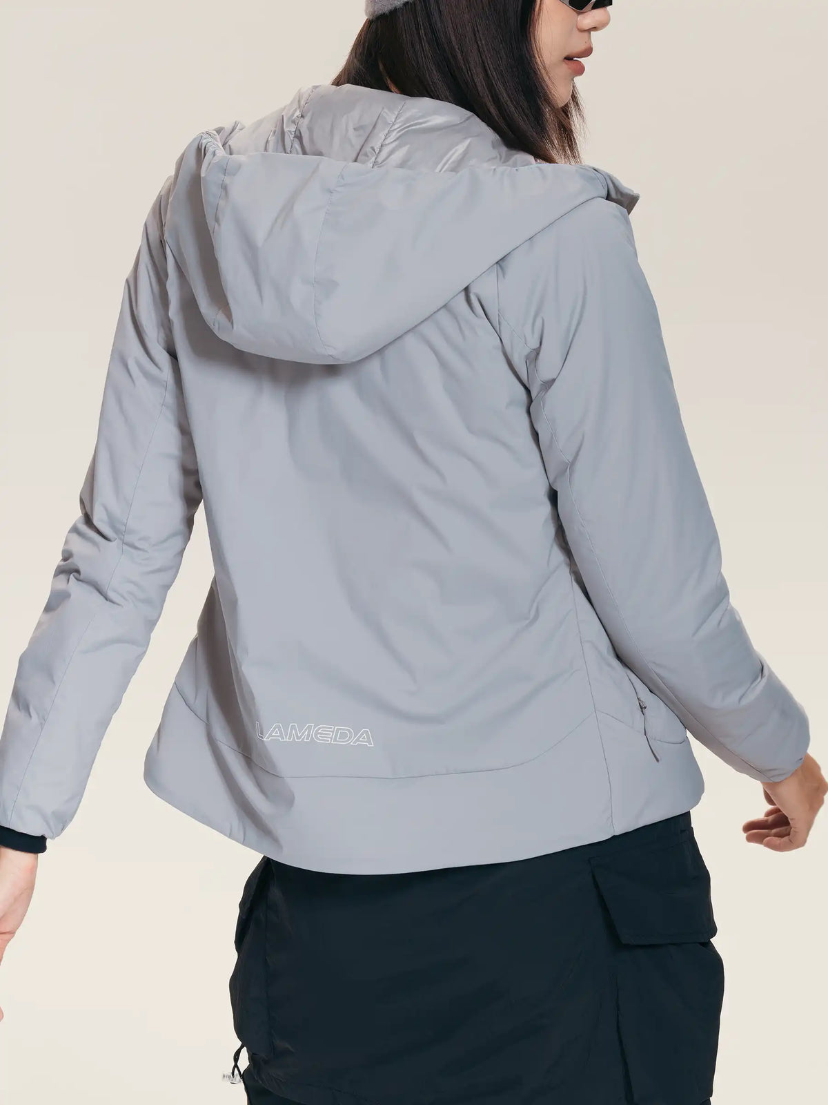Light gray lameda women’s insulated jacket with hood featuring 3m™ thinsulate™ shown from the back side