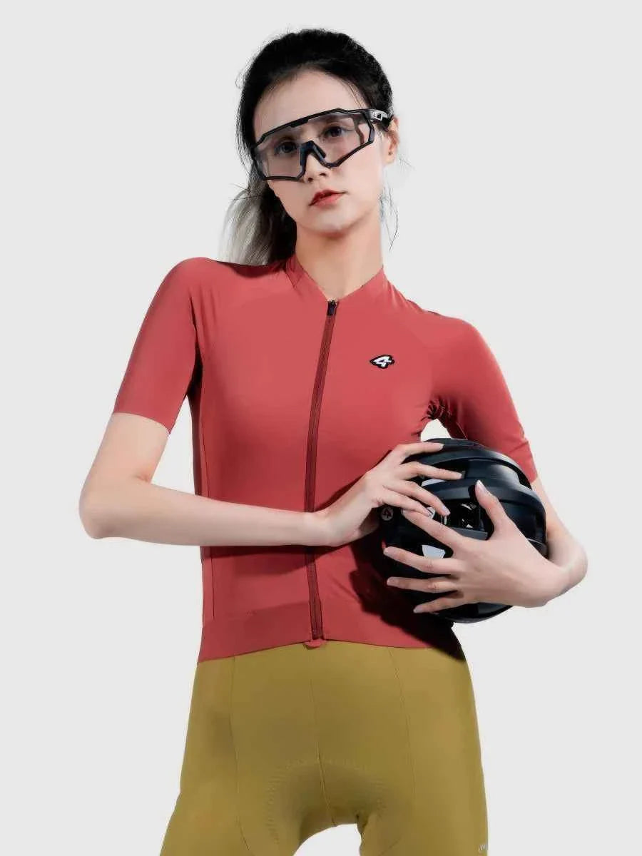 A sleek black cycling helmet with matte finish complements the ripple grace women’s red cycling jersey with anti-slip hem