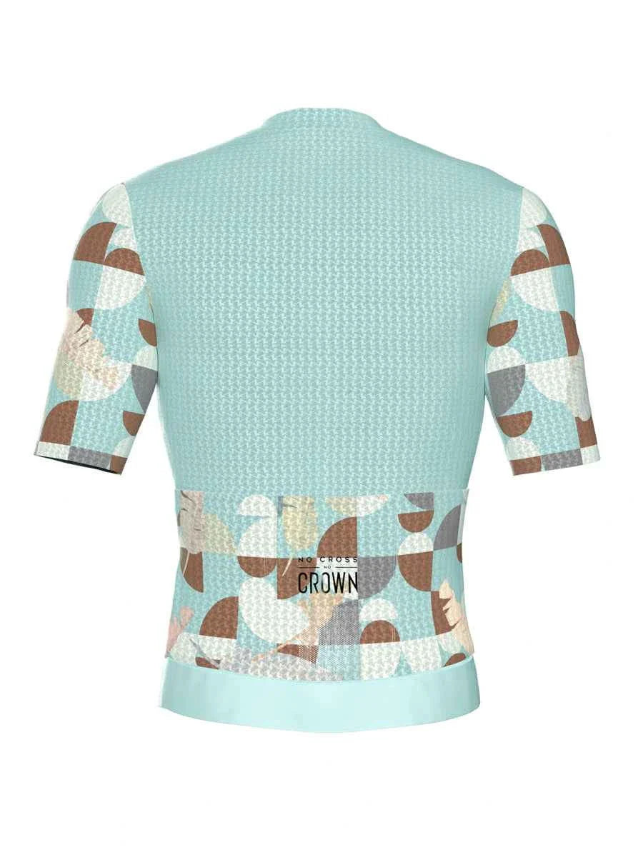 A light blue cycling jersey with geometric brown gray and cream pattern on sleeves and lower back relaxed fit trending mens cycling jersey green
