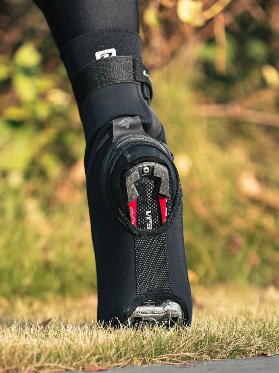 Black waterproof warm shoe cover with red gray accents and mesh panel ideal for cycling shoe covers in light rain and road splashes