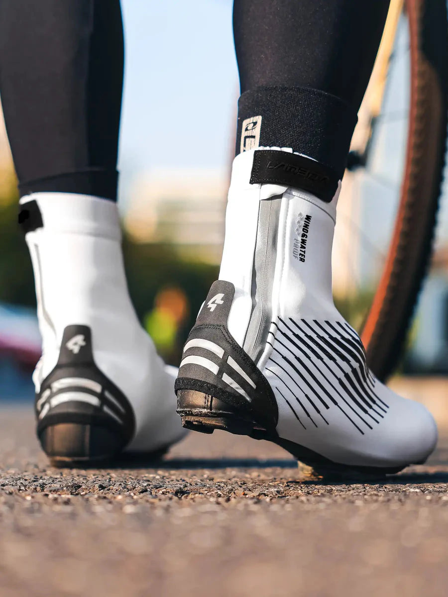 White and black warm shoe cover cycling shoe covers with aerodynamic diagonal stripes and logo on the heel for light rain and road splashes