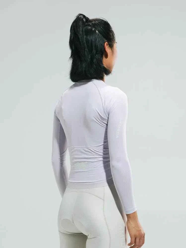 A sleek white lameda women’s cycling jersey with moisture-wicking fabric and anti-slip hem for comfortable riding