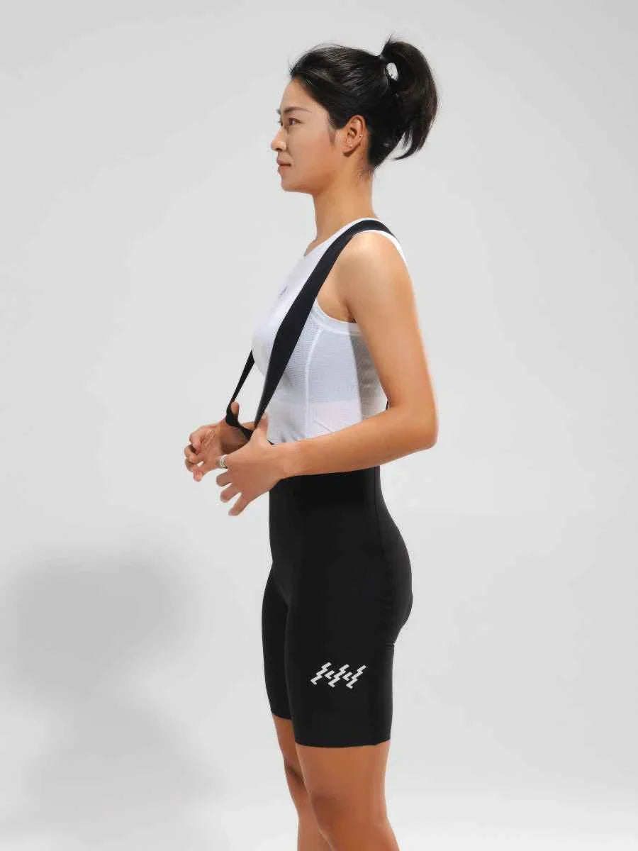 Women’s elite bib shorts 2025ssxx488 black with white zigzag logo, breathable mesh waistband, and anti-slip leg grippers