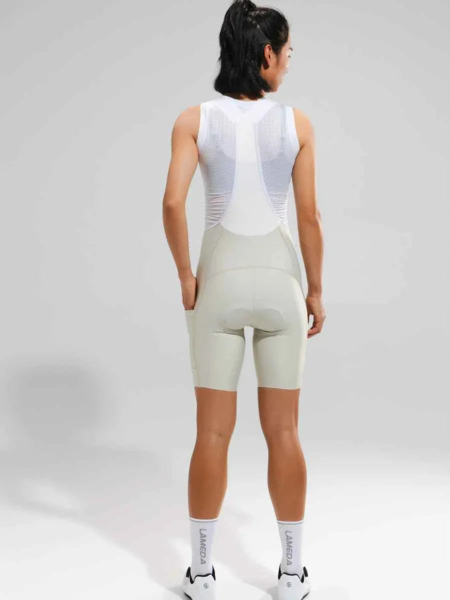 Women’s elite bib shorts 2025ssxx488 cream with a breathable mesh waistband and anti-slip leg grippers for cycling